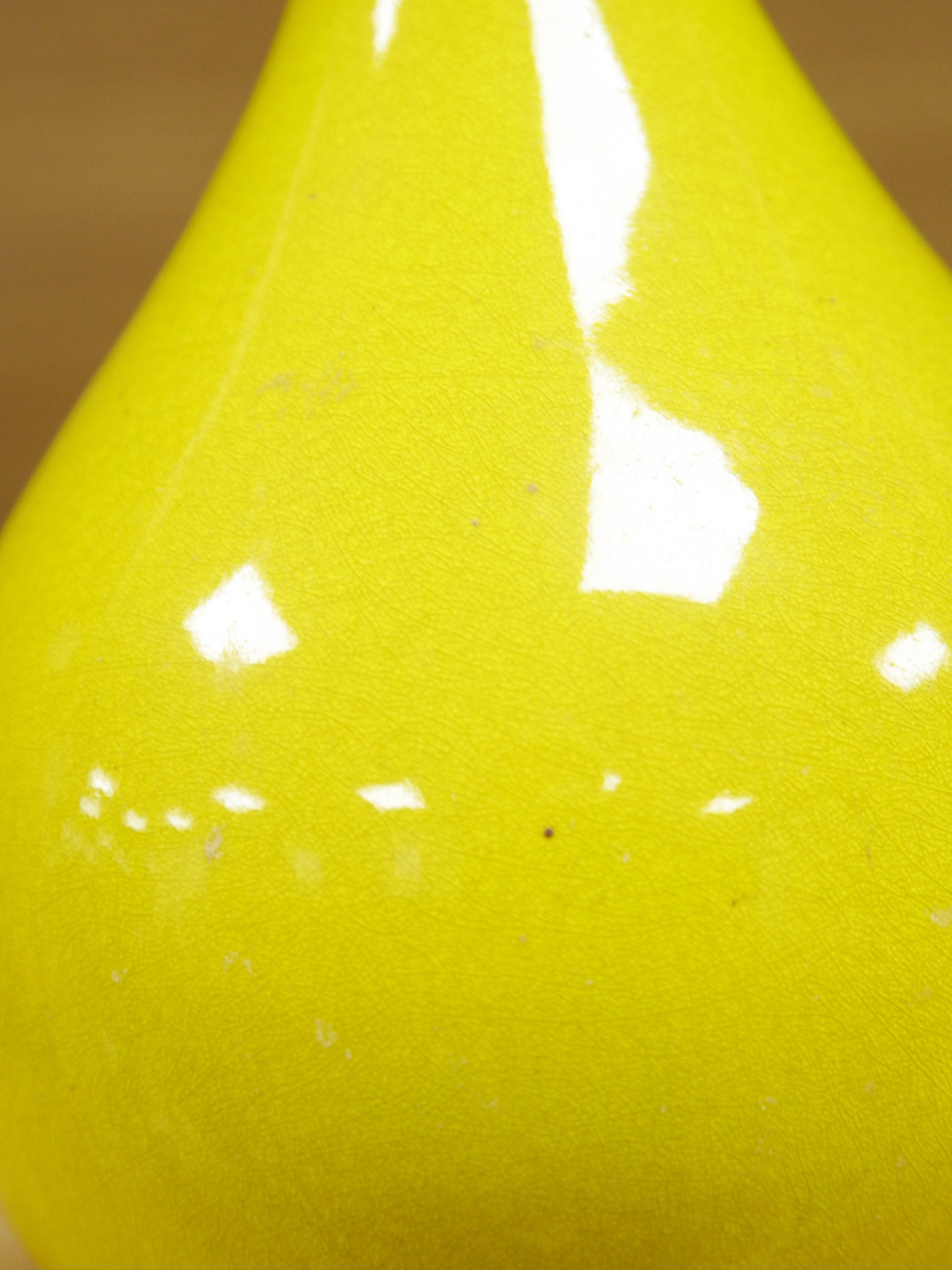 A Chinese or Japanese monochrome yellow bottle vase, 32cm high. Condition - crazed